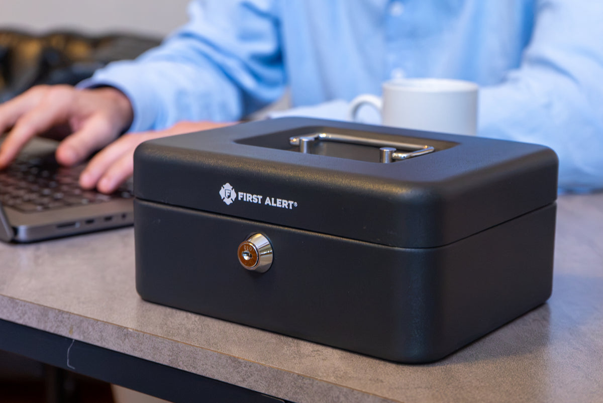 First Alert locking Cash Security Box, made from powder coated steel, Removable 3 compartment cash tray. Model 6202F