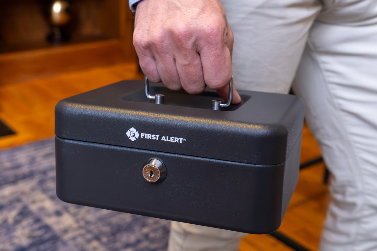 First Alert locking Cash Security Box, made from powder coated steel, Removable 3 compartment cash tray. Model 6202F